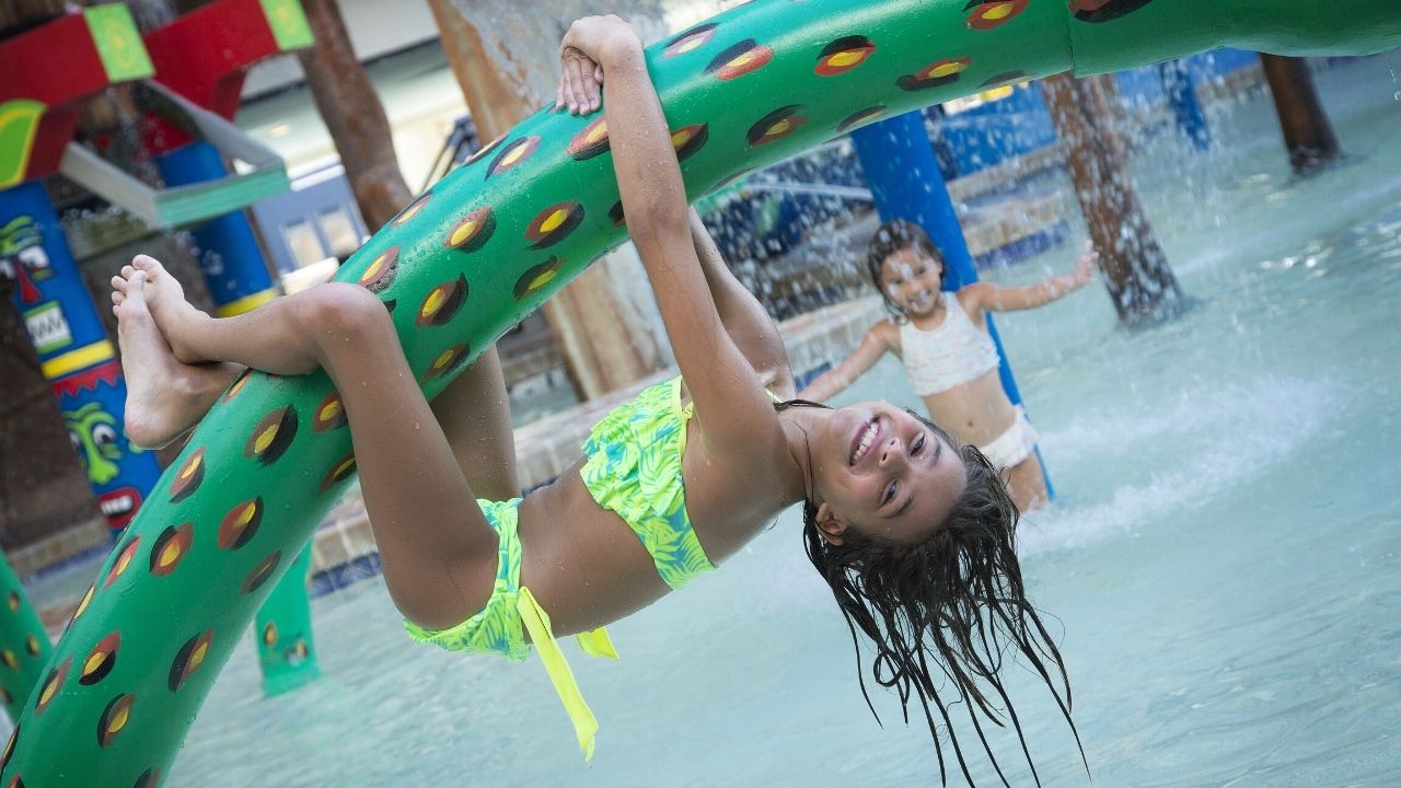 Girl Hanging from Snake at Water Park