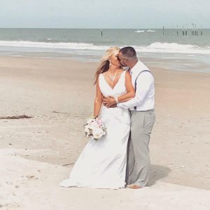 paradise-couple-kissing-getting-married-on-beach