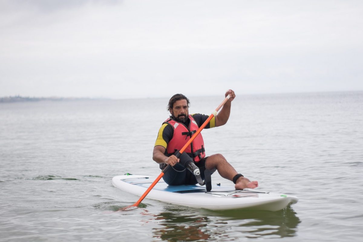 Man riding Kayak in water